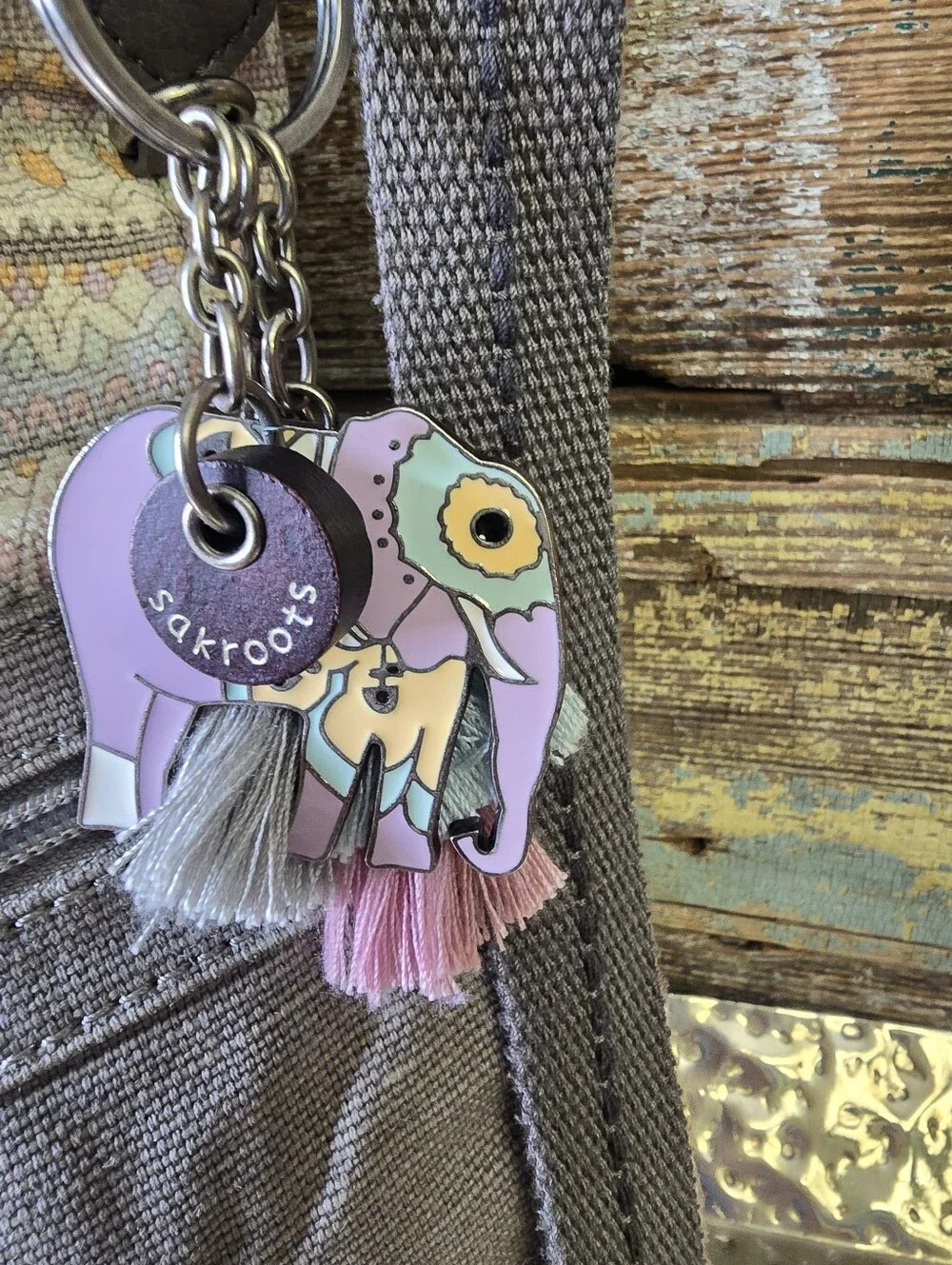 Sakroots Gray Crossbody with Pastel Pattern and Tassel Charm